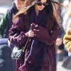 Shop New York City Anne Hathaway Burgundy Bomber Coat
